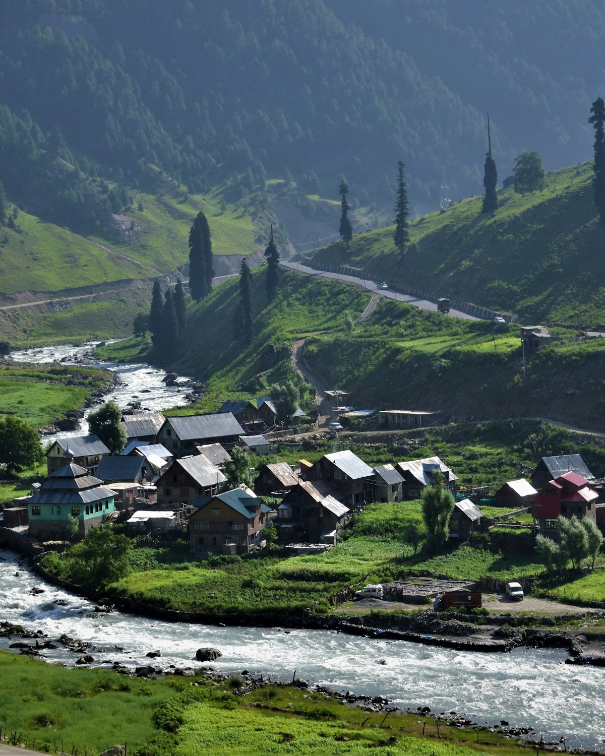 Green fields and orchards in a Ghizer valley, representative of the Sher Qila area