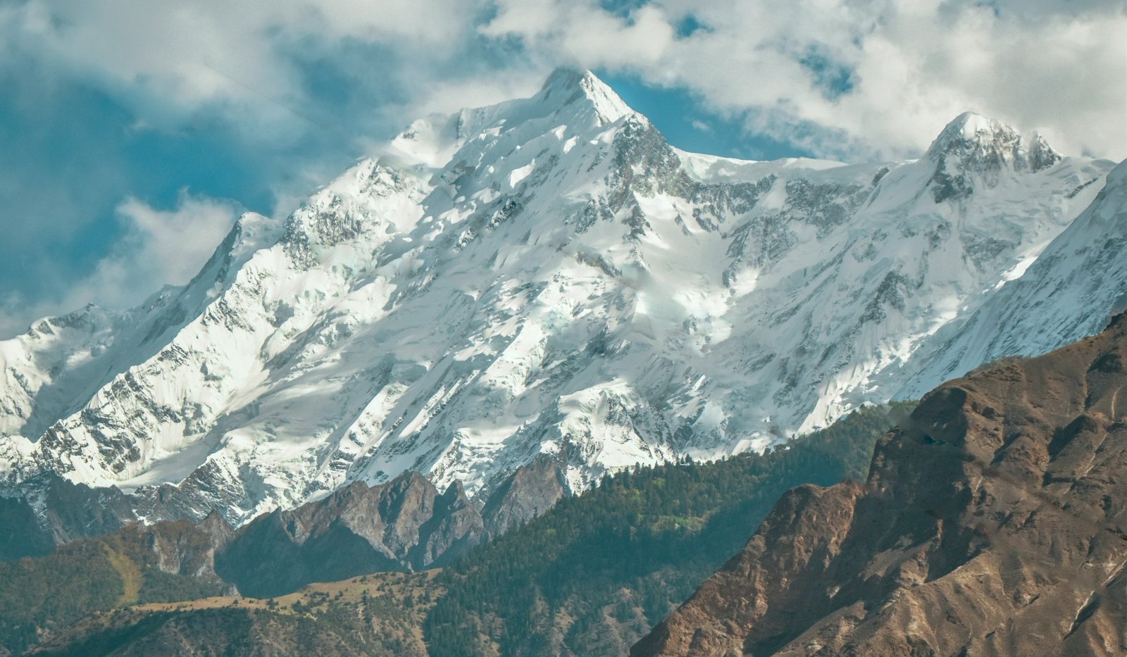 The snow-covered peak of Rakaposhi rising above the Hunza-Nagar valley
