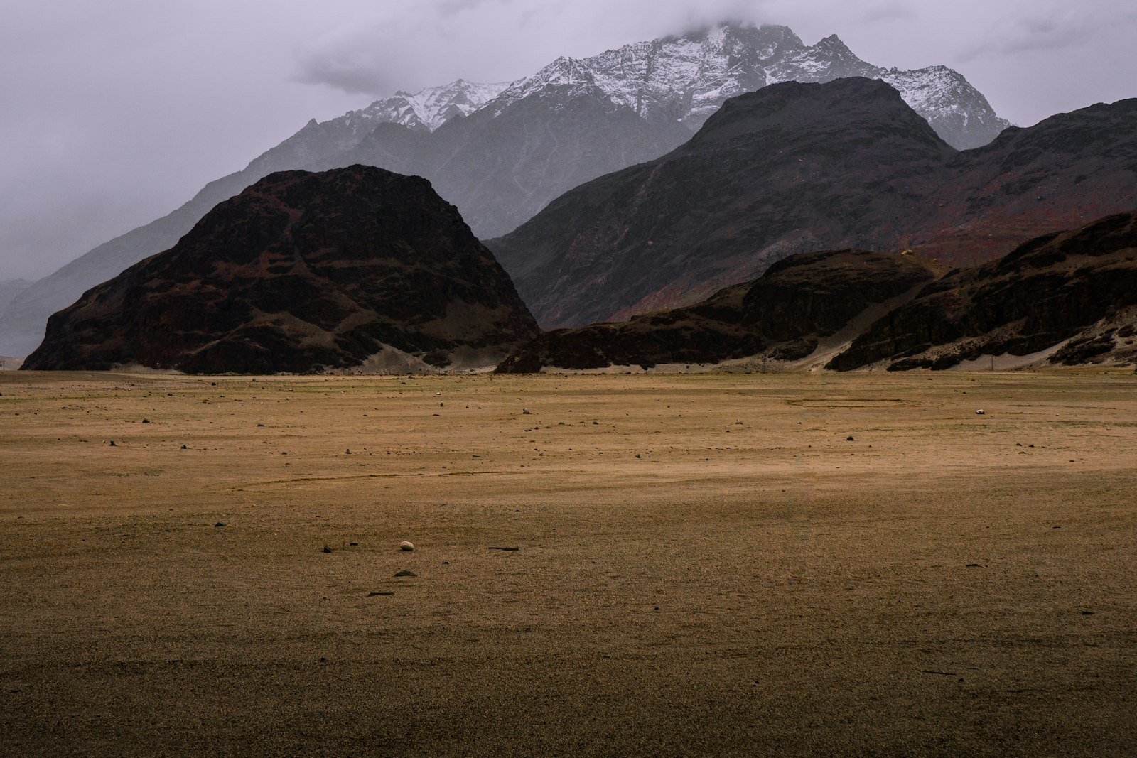 Sand dunes of the Katpana cold desert beneath Karakoram mountains near Skardu
